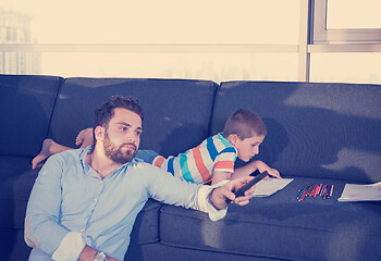 Image showing Happy Young Family Playing Together on sofa