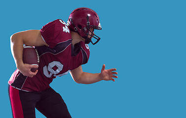 Image showing American football Player running with the ball