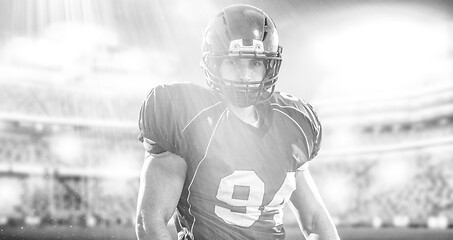 Image showing American Football Player isolated on big modern stadium field