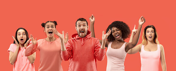 Image showing The collage of faces of surprised people on coral backgrounds.