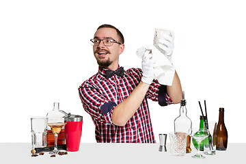 Image showing Expert barman is making cocktail at studio