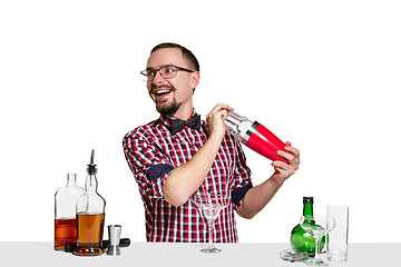 Image showing Expert barman is making cocktail at studio