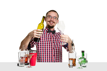 Image showing Expert barman is making cocktail at studio