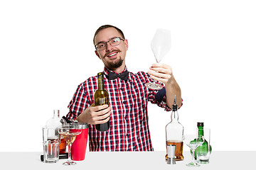 Image showing Expert barman is making cocktail at studio
