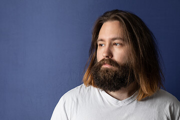 Image showing bearded young man with long hair