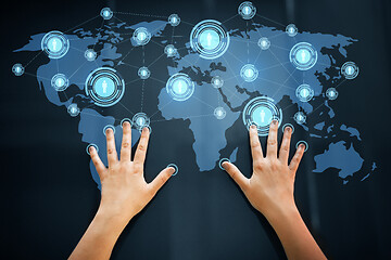 Image showing hands using interactive panel with network icons