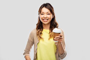 Image showing happy asian woman drinking coffee