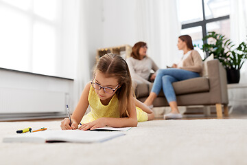 Image showing student girl writing to notebook at home