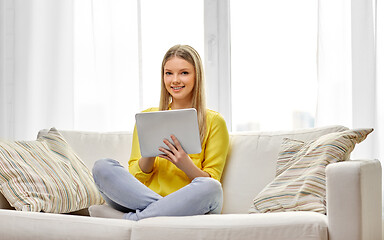 Image showing young woman or teenage girl with tablet pc at home