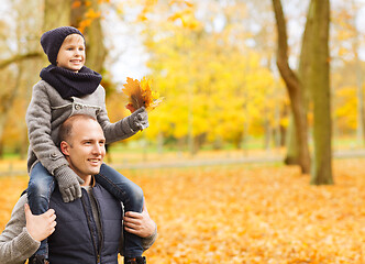 Image showing happy family having fun in autumn park