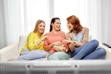 Image showing teenage girls or friends watching tv at home