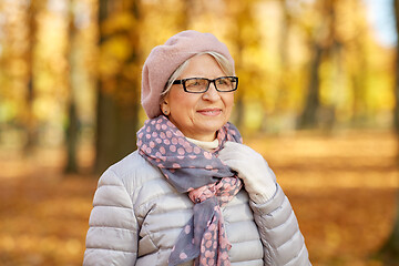 Image showing portrait of happy senior woman at autumn park