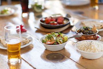 Image showing salad with other food on indian restaurant table