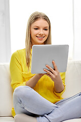 Image showing young woman or teenage girl with tablet pc at home