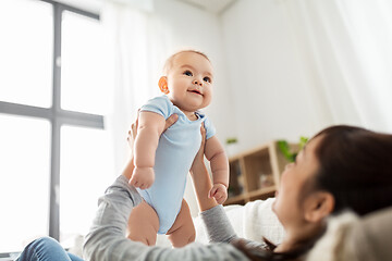 Image showing happy mother with little baby son at home