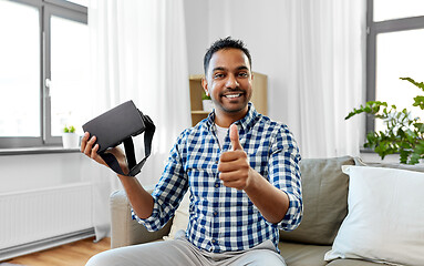 Image showing male blogger with vr glasses videoblogging at home