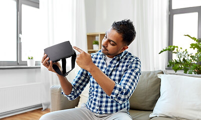 Image showing male blogger with vr glasses videoblogging at home