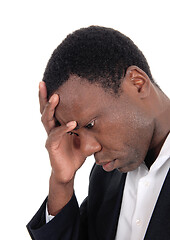 Image showing Depressed African man with hand on face