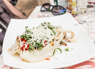 Image showing Cuttlefish with tomato, salad and Parmigiano cheese