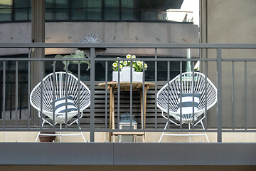 Image showing two chairs at a balcony in New York City