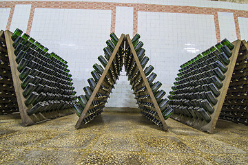 Image showing White sparkling wine bottles storage