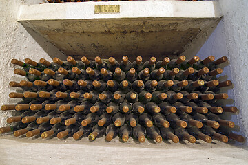 Image showing Dirty wine bottle in winery