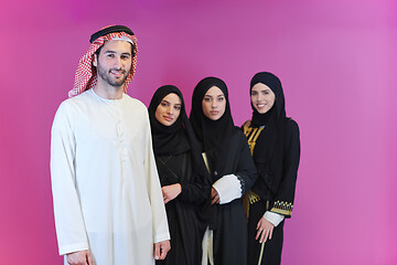 Image showing portrait of young muslim people isolated on pink