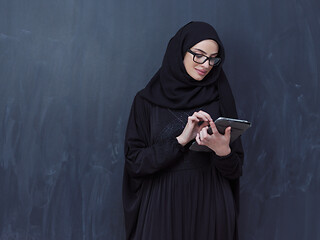 Image showing young muslim business woman using tablet computer