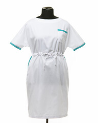 Image showing Female medical gown on a mannequin for clothes on a white background, front view