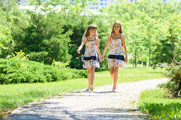 Image showing girls walk in the park and chat with each other