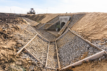 Image showing Construction of a drainage ditch along a new road being built