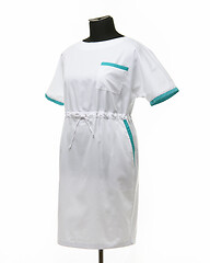 Image showing Female medical gown on a mannequin for clothes on a white background