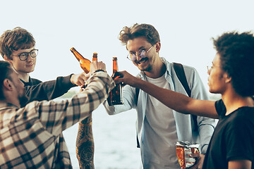 Image showing Group of friends celebrating, resting, having fun and party in summer day