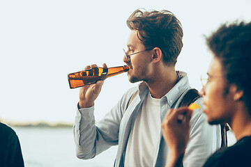 Image showing Group of friends celebrating, resting, having fun and party in summer day