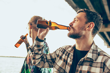 Image showing Group of friends celebrating, resting, having fun and party in summer day