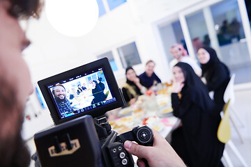 Image showing professional videographer recording Ramadan feast