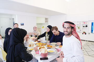 Image showing young arabian man having Iftar dinner with muslim family