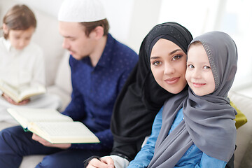 Image showing muslim family reading Quran and praying at home