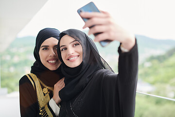 Image showing muslim women taking selfie picture on the balcony