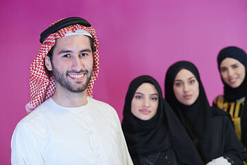 Image showing portrait of young muslim people isolated on pink