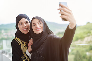 Image showing muslim women taking selfie picture on the balcony