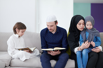 Image showing muslim family reading Quran and praying at home