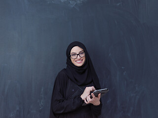 Image showing young muslim business woman using tablet computer