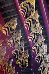 Image showing Spiral incense burning hanging in Vietnamese temple