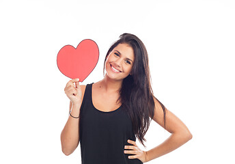 Image showing beautiful happy young woman who is holding a big red heart for v