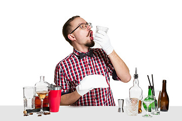 Image showing Expert barman is making cocktail at studio