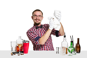 Image showing Expert barman is making cocktail at studio