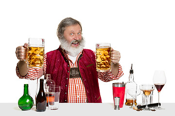 Image showing Expert barman with beer at studio