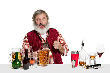 Image showing Expert barman with beer at studio