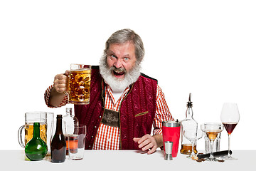 Image showing Expert barman with beer at studio